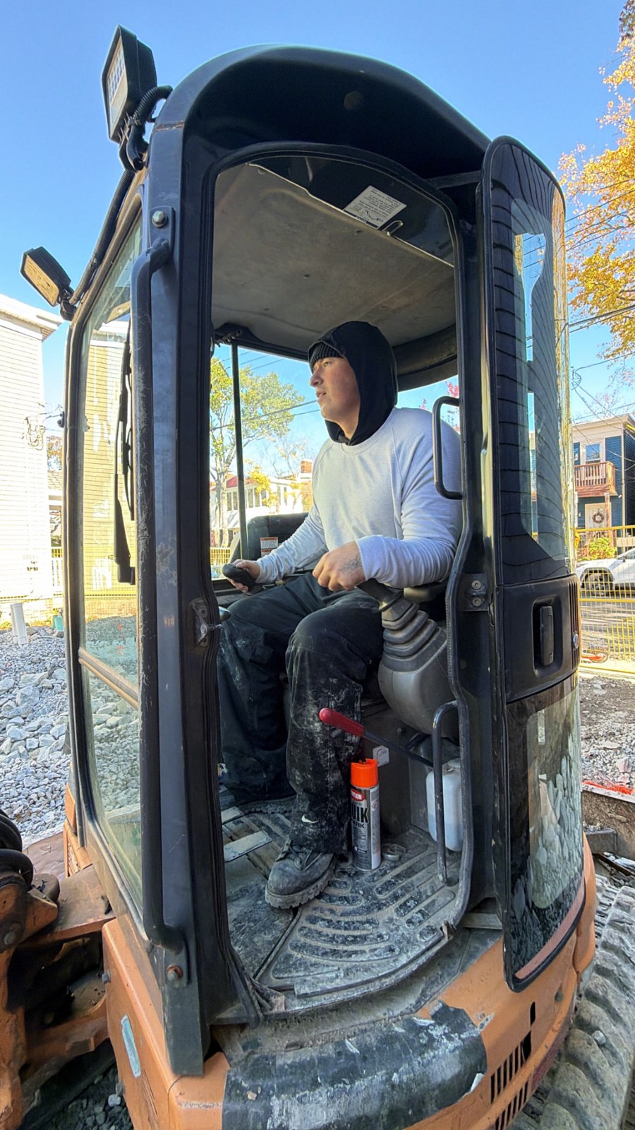 Cedar and Oak crew member operating a compact excavator